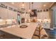 Gourmet kitchen with modern cabinets, stainless steel appliances, and a large island with seating for entertaining at 3177 Armeria Dr, Apex, NC 27502