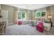 Spacious living room with large windows, a sectional sofa, and decorative accents at 3177 Armeria Dr, Apex, NC 27502