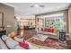 Open floor plan showcasing the kitchen, dining, and living spaces with natural light at 3177 Armeria Dr, Apex, NC 27502