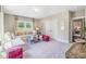 Open-concept living room featuring neutral tones, ample seating, and abundant natural light at 3177 Armeria Dr, Apex, NC 27502