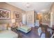 Comfortable sitting area with hardwood floors, chaise lounges, and a view of the staircase at 3177 Armeria Dr, Apex, NC 27502