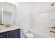 Stylish bathroom featuring a shower-tub combo and a vanity with modern fixtures and ample storage at 3301 Oakfields Rd # 2, New Hill, NC 27562