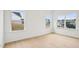 Bedroom with neutral paint, wood floors, and natural light through windows at 3301 Oakfields Rd # 2, New Hill, NC 27562