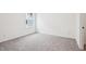 Bright bedroom featuring neutral carpet, white walls, a window and a convenient doorway at 3301 Oakfields Rd # 2, New Hill, NC 27562