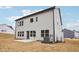Exterior rear view of a home featuring light gray siding, a concrete patio, and a newly graded lawn at 3301 Oakfields Rd # 2, New Hill, NC 27562