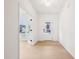 Bright hallway with neutral paint, wood floors, and natural light at 3301 Oakfields Rd # 2, New Hill, NC 27562