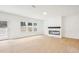 Open living room featuring hardwood floors, recessed lighting, fireplace, and multiple windows at 3301 Oakfields Rd # 2, New Hill, NC 27562