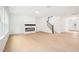 Open floor plan living room with wood floors, neutral paint, and modern fireplace at 3301 Oakfields Rd # 2, New Hill, NC 27562