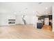 Living room featuring open floor plan, fireplace, stairs, and bright lighting at 3301 Oakfields Rd # 2, New Hill, NC 27562