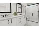 Modern bathroom with double vanity, frameless shower, and white and black accents at 4043 Elk Creek Ln # 15, Raleigh, NC 27612