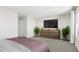 Spacious bedroom with dresser and large TV at 4043 Elk Creek Ln # 15, Raleigh, NC 27612