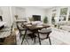 Modern dining room with a long wooden table and plenty of seating for guests at 4043 Elk Creek Ln # 15, Raleigh, NC 27612