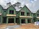 Brand new townhouses under construction, featuring contemporary design and attached garages at 4043 Elk Creek Ln # 15, Raleigh, NC 27612