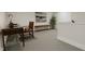 Home office with desk, chair, and built-in shelving at 4043 Elk Creek Ln # 15, Raleigh, NC 27612