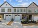 Charming townhome showcasing a well-maintained facade with a welcoming entrance and a two-car garage at 507 Excelsior Ct, Rolesville, NC 27587