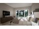 A bedroom with a large window and a view of the trees at 60 Chestnut Oak Dr, Youngsville, NC 27596