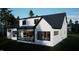 Modern home exterior boasting white siding, black accents, an enclosed outdoor living area, and natural light at 60 Chestnut Oak Dr, Youngsville, NC 27596