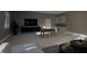 Cozy living room with a foosball table and modern decor at 60 Chestnut Oak Dr, Youngsville, NC 27596