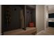 Well-organized mudroom with built-in storage, coat hooks, bench seating, and access to hallway at 60 Chestnut Oak Dr, Youngsville, NC 27596