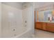 Bathroom featuring a bathtub, shower, and double sink vanity with storage at 113 S Friars Chase Ln, Fuquay Varina, NC 27526