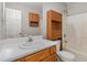 Functional bathroom featuring ample cabinet space, a large mirror and a shower/tub combo at 113 S Friars Chase Ln, Fuquay Varina, NC 27526