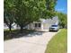Inviting home with a lush lawn, long driveway and attached garage at 113 S Friars Chase Ln, Fuquay Varina, NC 27526