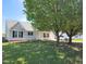 Charming home with mature trees in the front yard at 113 S Friars Chase Ln, Fuquay Varina, NC 27526