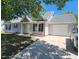 Charming single-story home featuring an attached garage and a well-manicured front lawn at 113 S Friars Chase Ln, Fuquay Varina, NC 27526