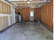 Spacious unfinished garage ready for customization and storage at 113 S Friars Chase Ln, Fuquay Varina, NC 27526