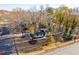 Aerial view of a home highlighting the surrounding greenery and street at 2804 Edgewood Ave, Burlington, NC 27215