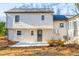 Exterior view of back of home with concrete patio and backyard at 2804 Edgewood Ave, Burlington, NC 27215