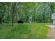 Large backyard includes a shed, offering extra storage, along with space for grilling at 2804 Edgewood Ave, Burlington, NC 27215