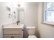 Bathroom with stylish vanity, modern fixtures, and a clean white toilet at 2804 Edgewood Ave, Burlington, NC 27215