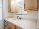 Bathroom featuring a natural wood vanity with light countertops and black hardware at 2804 Edgewood Ave, Burlington, NC 27215