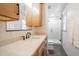 Bathroom featuring tile floors, natural wood vanity, and glass shower enclosure at 2804 Edgewood Ave, Burlington, NC 27215