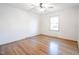Bedroom with hardwood floors, ceiling fan, and ample natural light at 2804 Edgewood Ave, Burlington, NC 27215