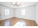 Bedroom with hardwood floors, two windows, and modern trim at 2804 Edgewood Ave, Burlington, NC 27215