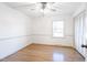 Bedroom featuring hardwood floors, ceiling fan, and window at 2804 Edgewood Ave, Burlington, NC 27215