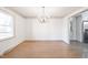 Dining room featuring hardwood floors and a modern light fixture, perfect for entertaining guests at 2804 Edgewood Ave, Burlington, NC 27215