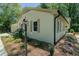 This home boasts a freshly painted exterior, tasteful landscaping, and a charming lamp post, adding to its curb appeal at 2804 Edgewood Ave, Burlington, NC 27215