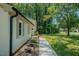 The house features a well-maintained walkway leading to the front door, complemented by tasteful landscaping at 2804 Edgewood Ave, Burlington, NC 27215