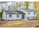 Charming exterior of a bright, two-story home with updated windows and a neatly maintained front yard at 2804 Edgewood Ave, Burlington, NC 27215