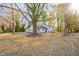Charming exterior view of home with mature trees and spacious front yard at 2804 Edgewood Ave, Burlington, NC 27215