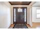 Welcoming foyer with a modern front door, striking rug, and freshly painted walls at 2804 Edgewood Ave, Burlington, NC 27215