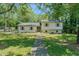Charming home with a well-maintained lawn and lush greenery, creating a welcoming curb appeal at 2804 Edgewood Ave, Burlington, NC 27215