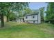Charming home with a well-manicured lawn, mature trees, and updated landscaping at 2804 Edgewood Ave, Burlington, NC 27215