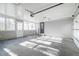 Sun-drenched two car garage with pedestrian door, concrete floors, and white walls at 2804 Edgewood Ave, Burlington, NC 27215