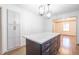 Elegant kitchen island with marble countertop and modern lighting fixtures at 2804 Edgewood Ave, Burlington, NC 27215