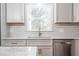 Bright kitchen featuring marble countertops, subway tile backsplash, and stainless steel appliances at 2804 Edgewood Ave, Burlington, NC 27215