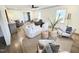 Open-concept living room with hardwood floors, stylish furniture, and lots of natural light at 2804 Edgewood Ave, Burlington, NC 27215